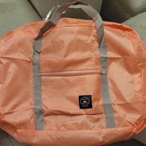 NWOT WIND BLOWS RIVER FLOWS PEACH LIGHT WEIGHT OVERNIGHT BAG. Created By Travel.